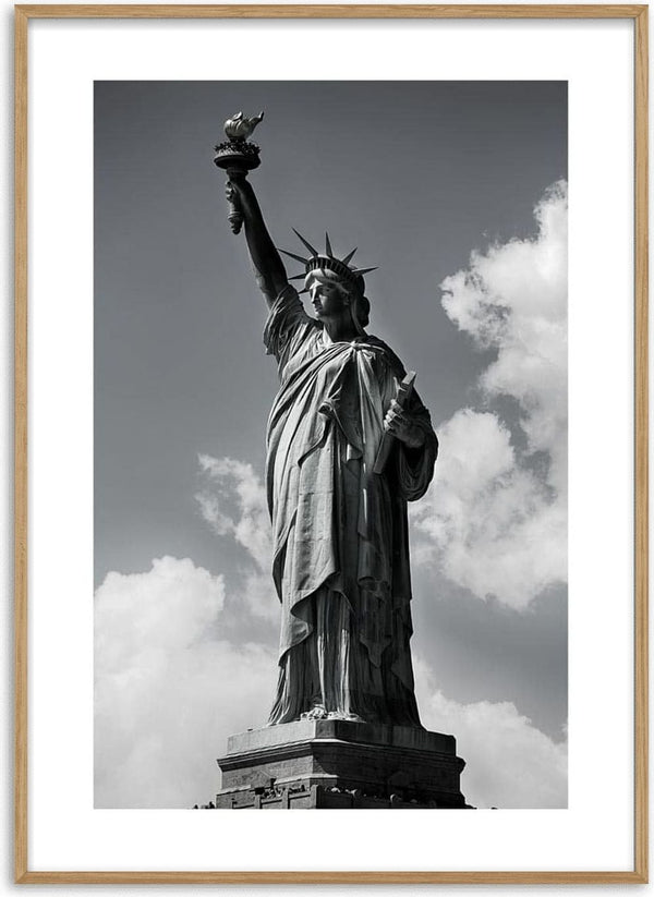 Black and white poster of the Statue of Liberty with a cloudy sky in the background.