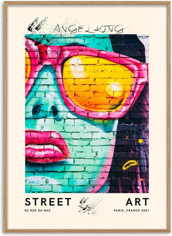 Colorful graffiti of a woman's face with sunglasses on a brick wall, featured on the Street Artsy Unique Plakat.