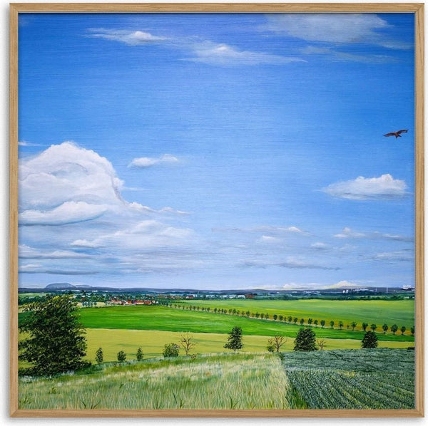 Uhlenhoch - East Germany by Juergen Duerrmann - a wide blue sky over green fields and a distant village