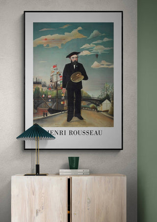 Framed print of "Self Portrait 1890" by Henri Rousseau, artist holding palette with cityscape background.